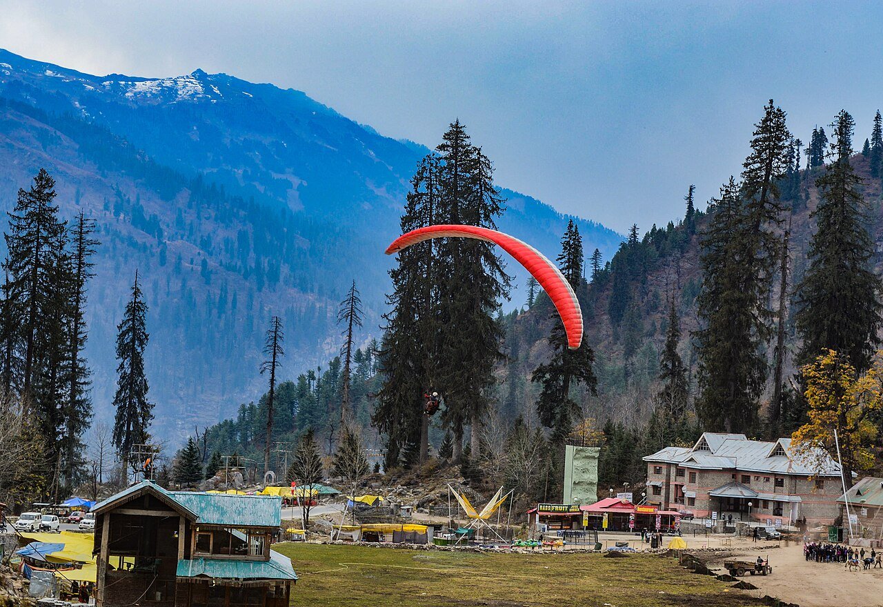 Paragliders over Solang Valley near Manali on an October bike rental day ride