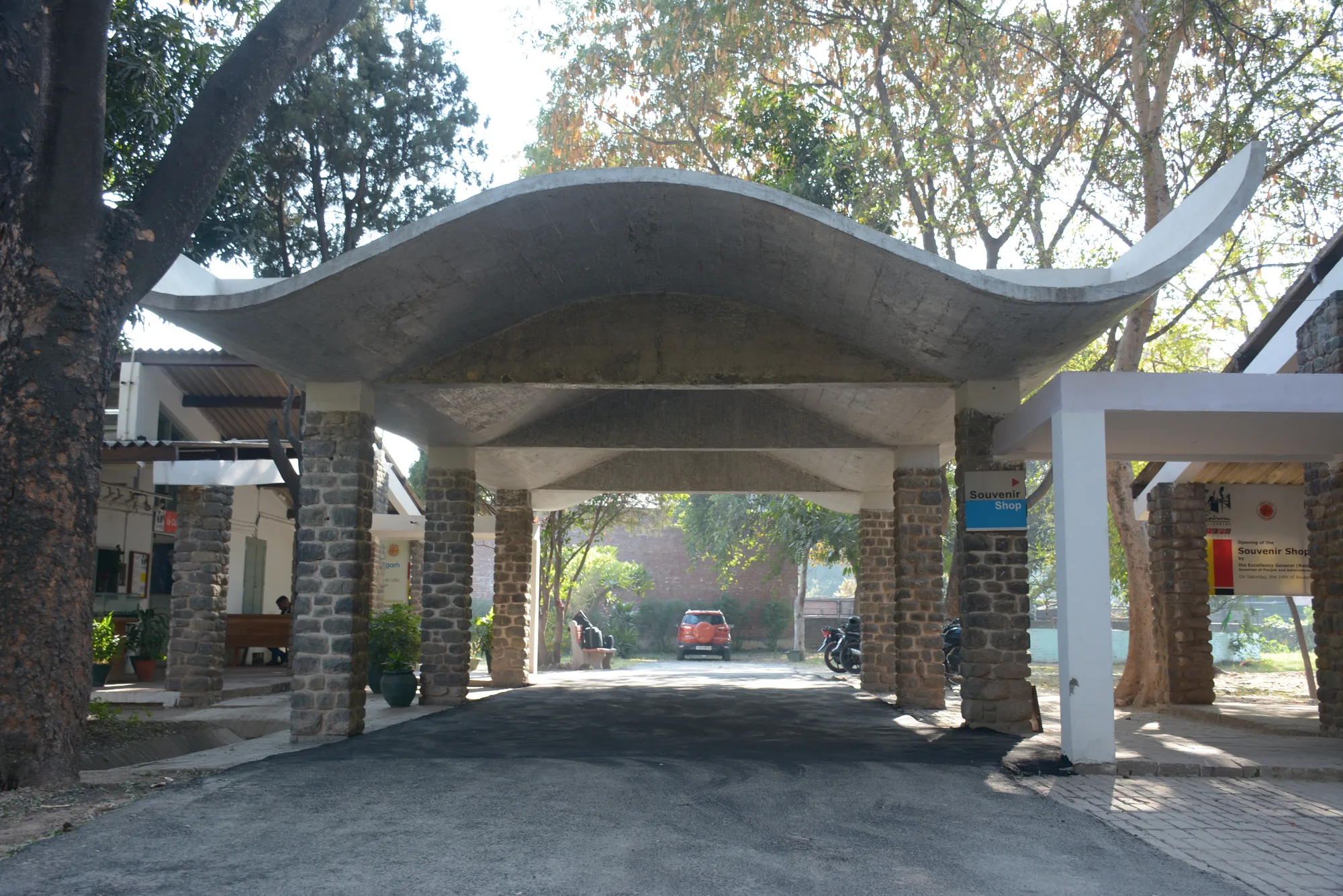 The curved concrete porch roof over the entrance driveway of the Le Corbusier Centre, the Old Architects' Office in Sector 19, Chandigarh