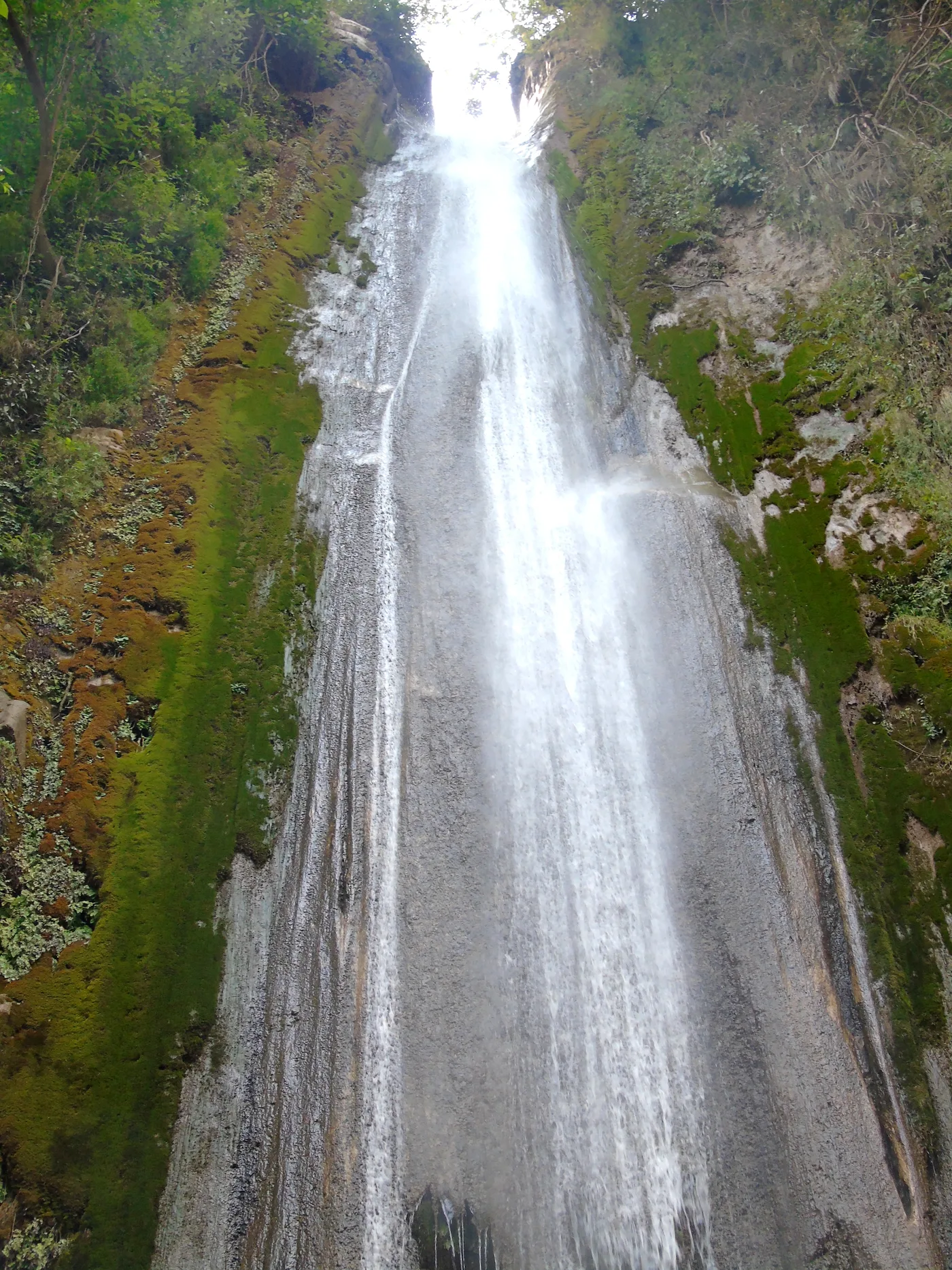 Tiger Falls near Chakrata, a tall single-drop waterfall over a mossy rock face
