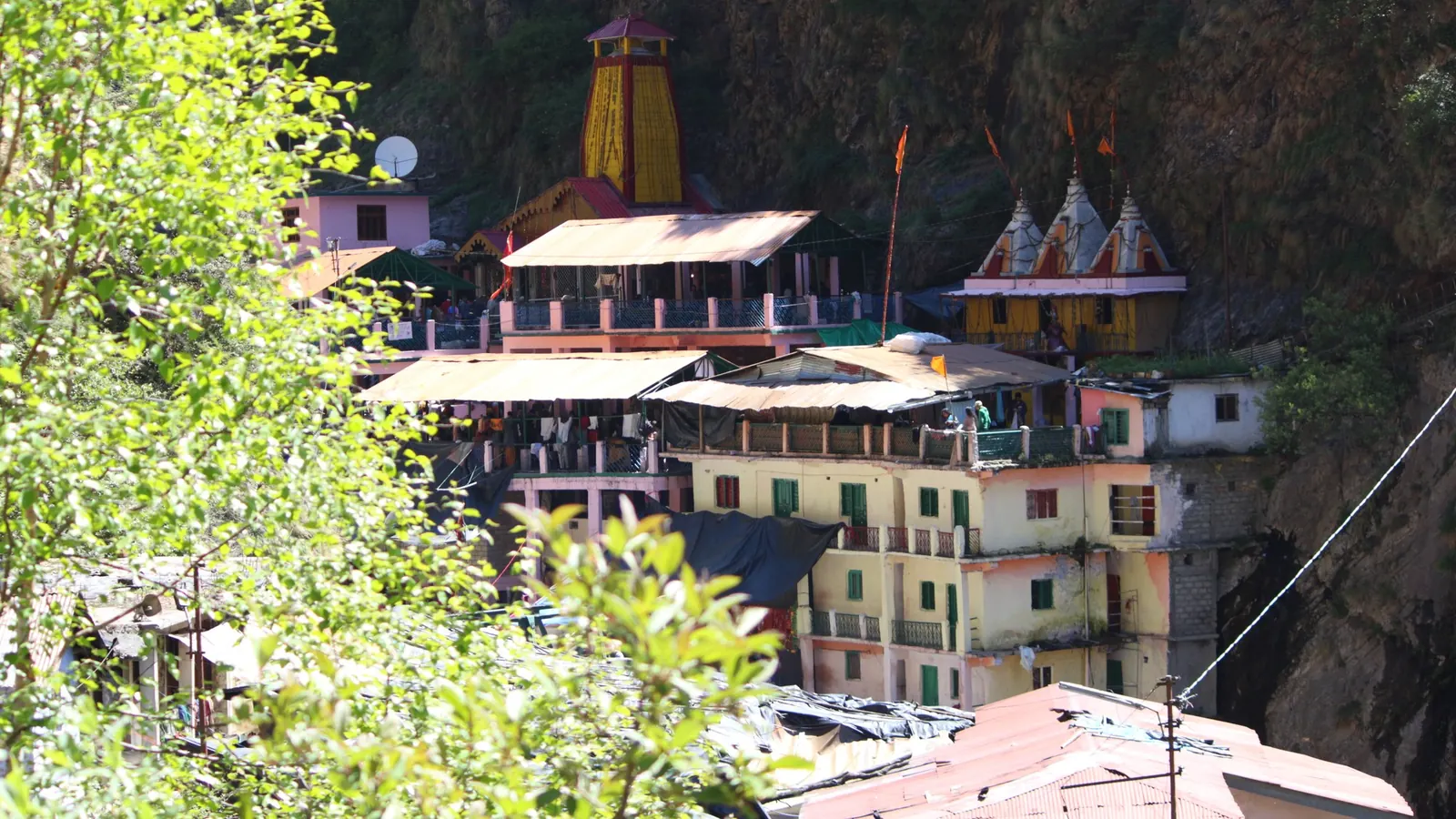 Yamunotri temple and ashram buildings against the cliff at the end of the walk from Janki Chatti