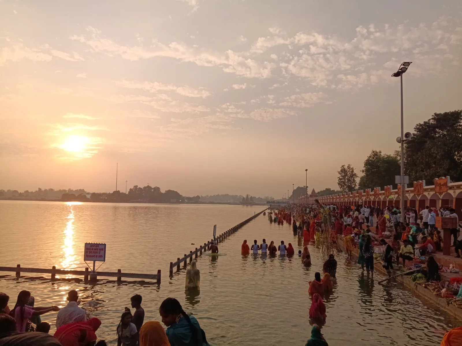 Sunrise over Brahma Sarovar in Kurukshetra with pilgrims bathing at the ghats, the first stop on a Delhi to Kurukshetra car day