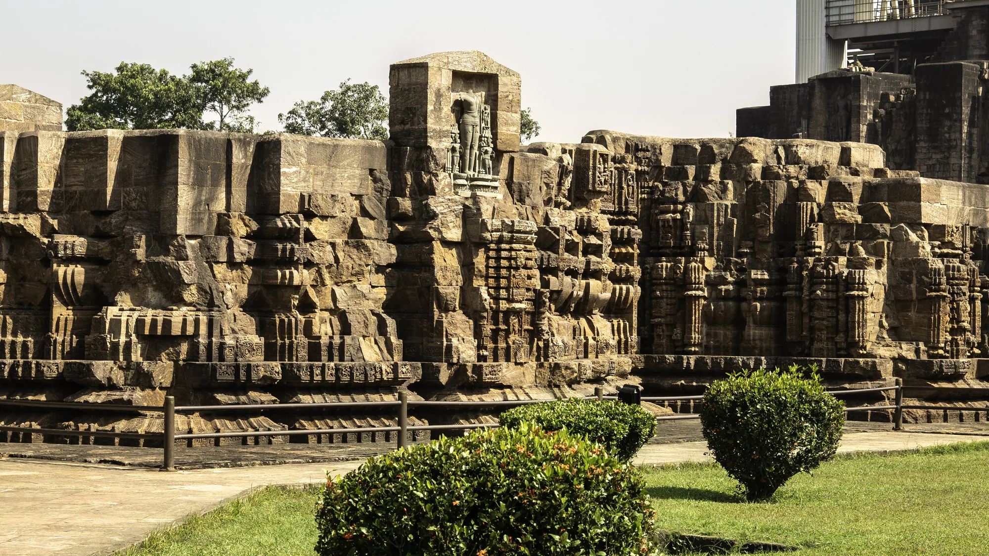 Weathered stone walls and carvings of the Konark Sun Temple in Odisha, a highlight reachable with self-drive car rental in Bhubaneswar