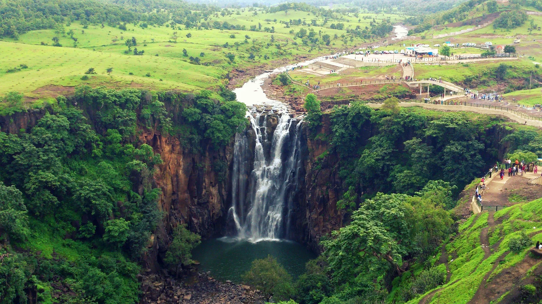 Patalpani waterfall dropping into a deep green gorge near Mhow, a day trip on a self-drive car rental in Indore