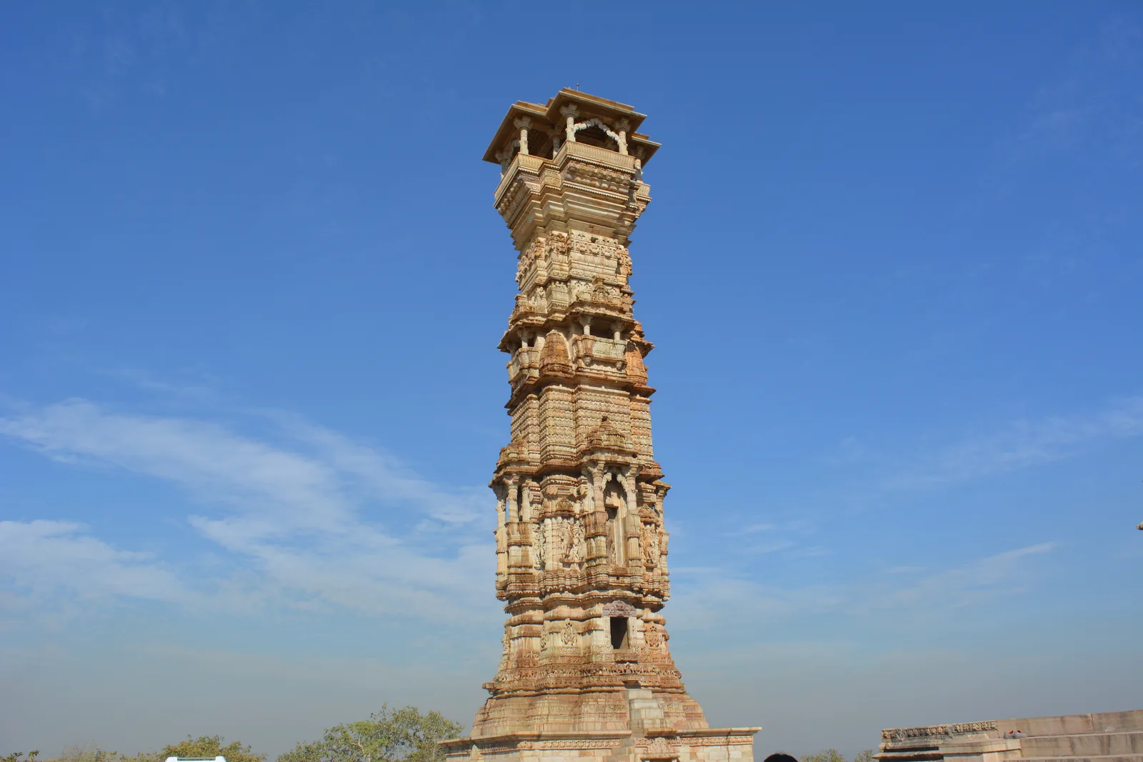 Kirti Stambh, the older Jain Tower of Fame at Chittorgarh Fort, with carved stone figures on every level