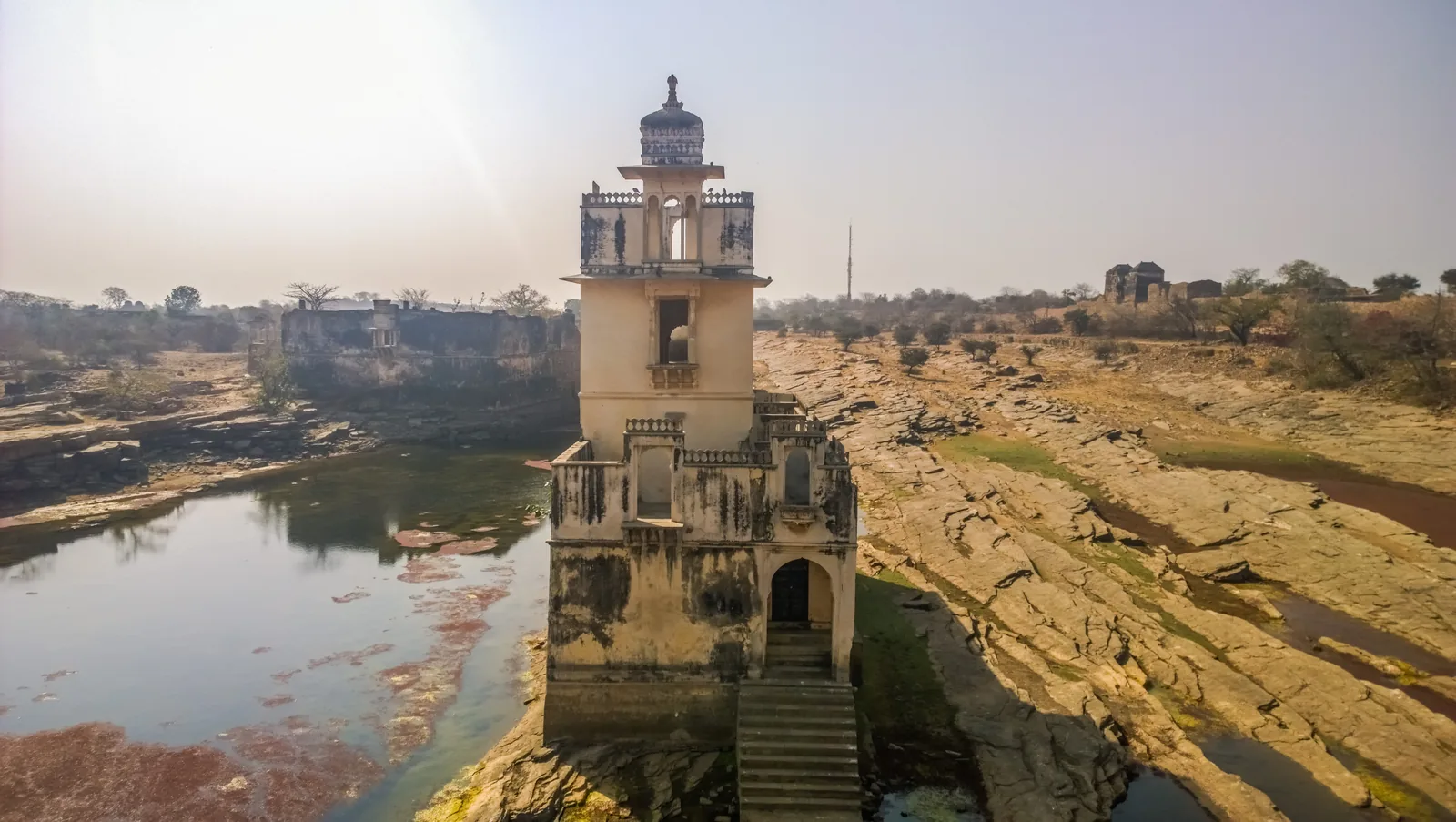 The small domed pavilion of Rani Padmini's palace standing in a shallow rocky pool in the southern part of Chittorgarh Fort