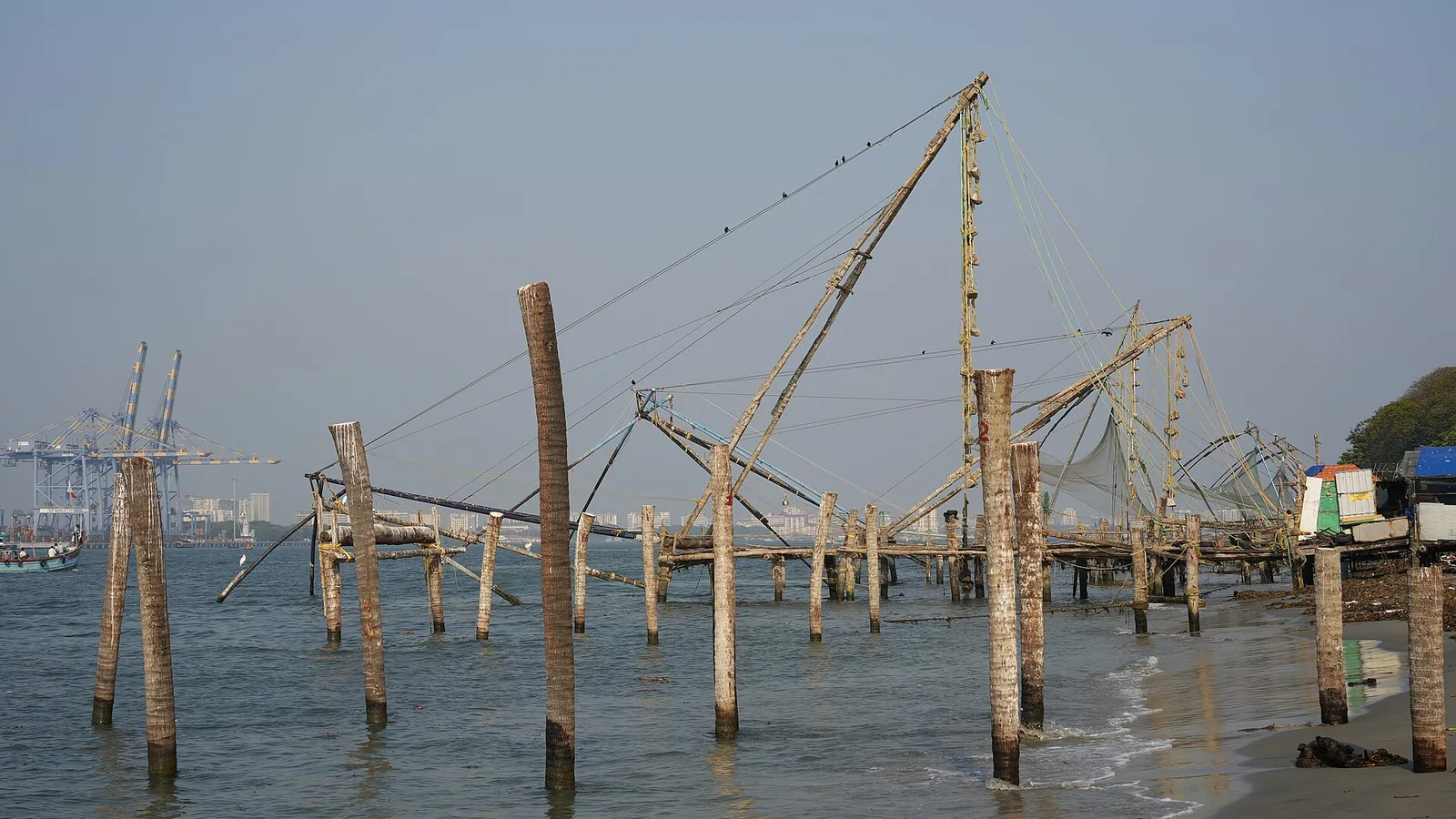 Chinese fishing nets silhouetted against the sky at Kochi
