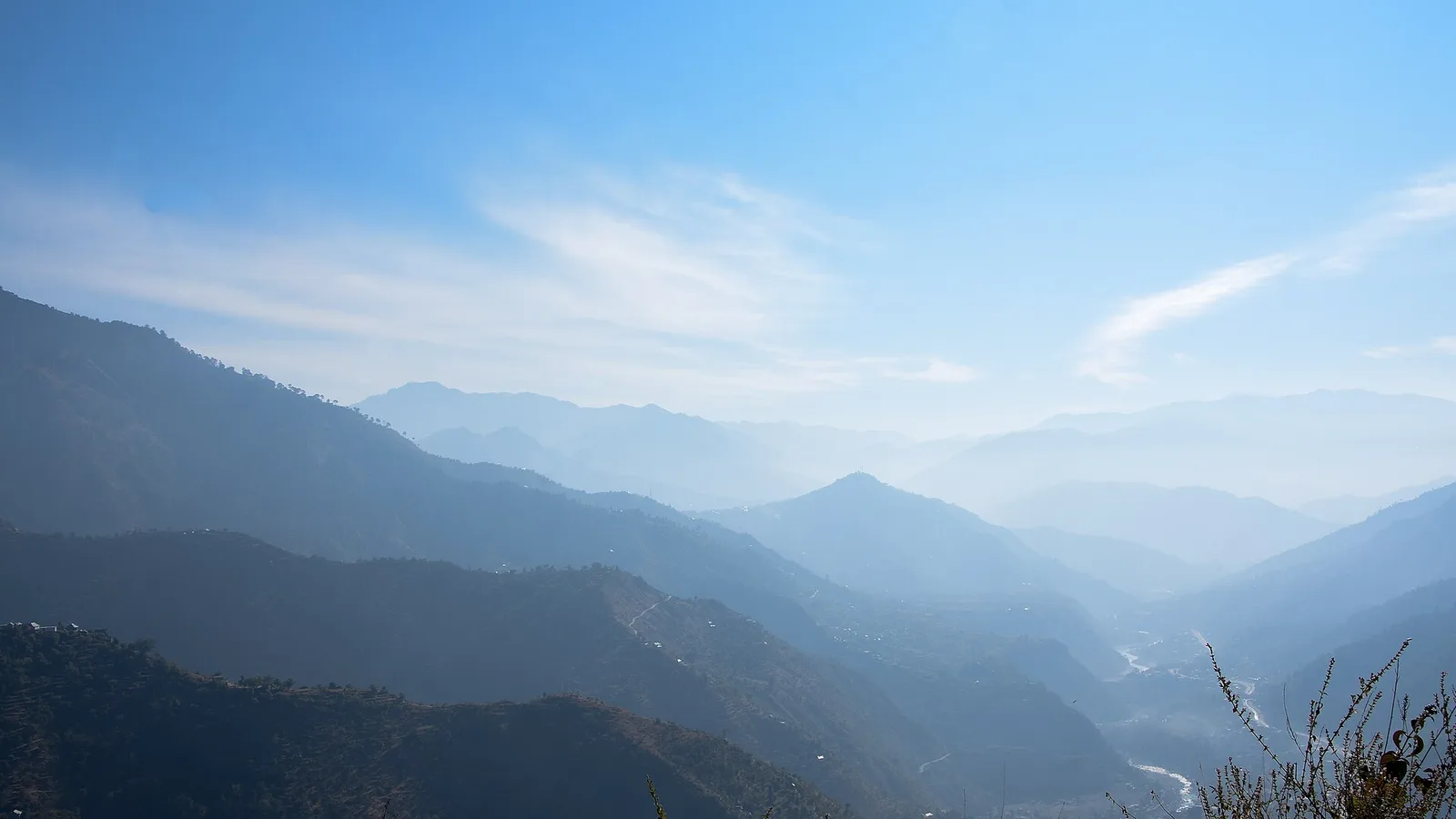 Layers of blue hazy hills of the Beas valley near Pandoh in Mandi district under a clear November sky